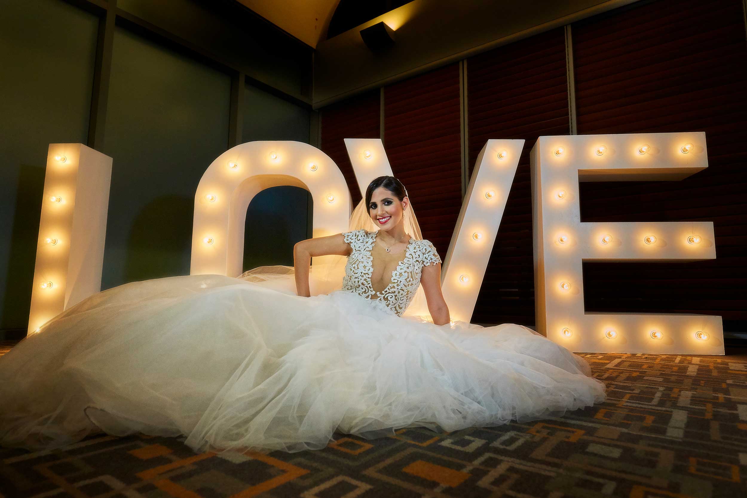 Bride posing with love sign