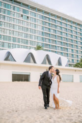 wedding couple at the beach in front of la concha perla san juan